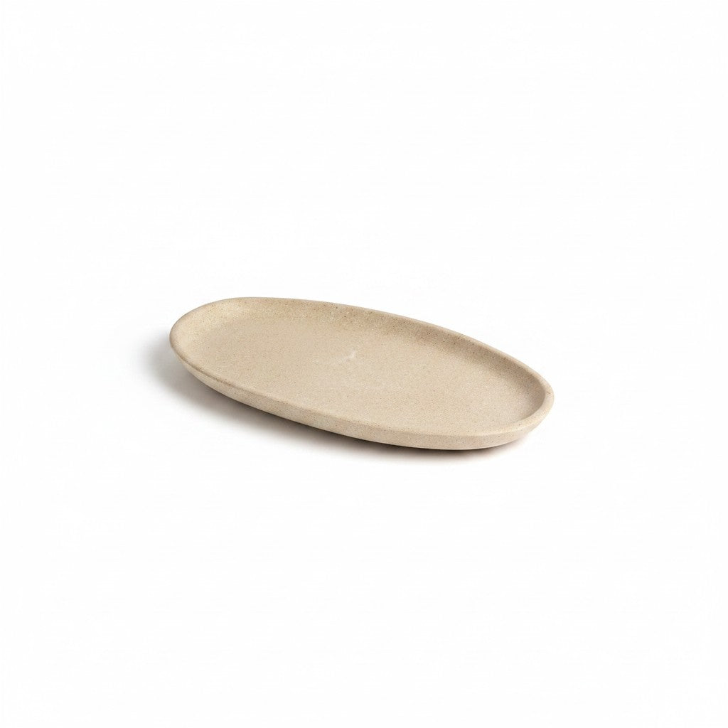 Solace & Smoke oval serving tray in beige melamine with a subtle speckled pattern, perfect for appetizers.