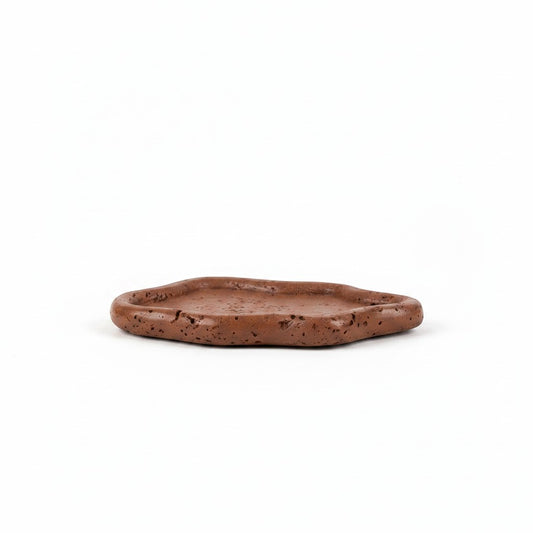 Solace & Smoke Lunar Tray in brown, a handcrafted Jesmonite dish with a rounded silhouette and textured finish.