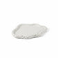 Solace & Smoke Lunar Tray in cloud stone Jesmonite, a shallow, rounded tray with a raised edge and textured finish.