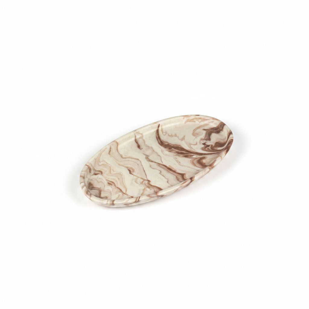 Solace & Smoke oval melamine serving tray with beige and brown marbled pattern.