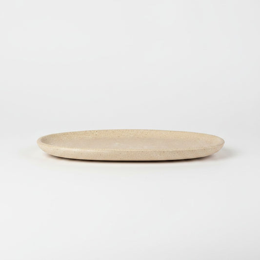 Solace & Smoke oval serving tray in speckled beige melamine with a subtle marbled pattern.