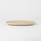 Solace & Smoke oval serving tray in speckled beige melamine with a subtle marbled pattern.